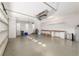 Spacious garage with bright lighting, ample storage, and work space on a concrete floor at 5093 Nw 35Th Lane Rd, Ocala, FL 34482