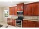 Well-appointed kitchen featuring granite countertops and stainless steel appliances at 5093 Nw 35Th Lane Rd, Ocala, FL 34482