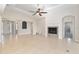 A bright, open living room with tile floors, fireplace, and sliders to the outside at 5093 Nw 35Th Lane Rd, Ocala, FL 34482