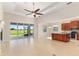 Bright, open-concept living room with tile floors and access to the backyard at 5093 Nw 35Th Lane Rd, Ocala, FL 34482