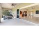 Spacious lanai with hot tub, kitchen view, and sliders to combine indoor-outdoor living at 5093 Nw 35Th Lane Rd, Ocala, FL 34482