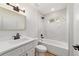 Bathroom featuring a shower-tub combo, modern fixtures, and white marble tiling at 5388 Nw 9Th St, Ocala, FL 34482