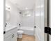 Stylish bathroom with a tub and shower combo, modern fixtures, and an open doorway at 5388 Nw 9Th St, Ocala, FL 34482