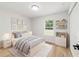 Bright bedroom with stylish decor, including framed art, decorative shelves and a fluffy rug at 5388 Nw 9Th St, Ocala, FL 34482