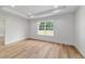 Sunlit bedroom with wood-look floors and neutral walls with recessed lighting at 5388 Nw 9Th St, Ocala, FL 34482