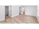 Open bedroom shows closet and en suite bathroom, enhanced by wood flooring and bright lighting at 5388 Nw 9Th St, Ocala, FL 34482