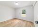 Empty bedroom with hardwood flooring, neutral walls, and a double-door closet at 5388 Nw 9Th St, Ocala, FL 34482
