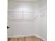 Bright and spacious closet with ample storage, featuring wood flooring and wire shelving at 5388 Nw 9Th St, Ocala, FL 34482