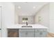 An island sink with quartz countertop and stainless steel dishwasher and wood flooring at 5388 Nw 9Th St, Ocala, FL 34482