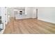Open-concept living area with new wood floors that flow into the kitchen and dining space at 5388 Nw 9Th St, Ocala, FL 34482