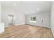 Bright and airy living room with hardwood floors, white walls, recessed lighting, and ample space at 5388 Nw 9Th St, Ocala, FL 34482