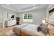 Inviting main bedroom features tray ceiling, modern furnishings, and a sun-filled window at 5388 Nw 9Th St, Ocala, FL 34482