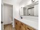 Bright bathroom with a wood vanity, white countertop, and modern fixtures at 5400 Nw 9Th St, Ocala, FL 34482