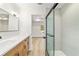 Bathroom showcasing a glass shower, wood vanity, and modern finishes at 5400 Nw 9Th St, Ocala, FL 34482