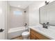 Bright bathroom featuring a tub, shower, and wood vanity at 5400 Nw 9Th St, Ocala, FL 34482