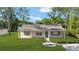 Beautiful single-story home with a covered porch and manicured front yard at 5400 Nw 9Th St, Ocala, FL 34482