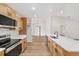 Well-lit kitchen features stainless steel appliances, ample cabinetry, and a breakfast bar at 5400 Nw 9Th St, Ocala, FL 34482