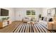 Bright living room with stylish furniture, wood flooring, and large windows at 5400 Nw 9Th St, Ocala, FL 34482