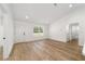 Open living space featuring recessed lighting, a large window, and durable wood-look floors at 5400 Nw 9Th St, Ocala, FL 34482
