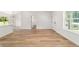 Spacious living room with hardwood floors and natural light streaming through large windows at 5400 Nw 9Th St, Ocala, FL 34482