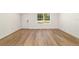 Clean and bright space with new hard wood floors, a window, and a door at 5400 Nw 9Th St, Ocala, FL 34482