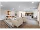 Open-concept living room showcasing modern furniture, stylish decor, and wood-look flooring at 585 Marion Oaks Pass, Ocala, FL 34473