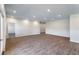 Expansive living room with wood-look flooring and abundant natural light, perfect for entertaining at 585 Marion Oaks Pass, Ocala, FL 34473