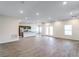 Spacious living area with modern finishes, wood-look flooring, and an open view to the kitchen at 585 Marion Oaks Pass, Ocala, FL 34473