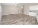 Spacious living room featuring wood-look flooring and ample natural light at 5908 Sw 111Th Place Rd, Ocala, FL 34476