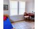 Well-lit bedroom with tile floors, bright furniture, and natural light from two windows at 626 Ne 21St St, Ocala, FL 34470