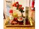Kitchen counter with an elegant tray holding flowers, coffee, candy, and kitchenware next to the window at 626 Ne 21St St, Ocala, FL 34470