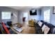 Inviting living room with comfortable sofas and an open doorway to the dining area at 626 Ne 21St St, Ocala, FL 34470
