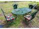 Outdoor patio with metal table and chairs featuring floral cushions at 626 Ne 21St St, Ocala, FL 34470