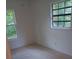 A bright bedroom with neutral walls and ample natural light at 6415 Ne 23Rd Ave, Ocala, FL 34479