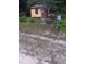 Cozy home with a charming front yard with green grass and landscaping at 6415 Ne 23Rd Ave, Ocala, FL 34479