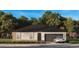 Single-story home with brown accents, gray roof, attached two-car garage and tidy landscaping at 7078 Sw 134 N St, Ocala, FL 34473