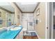 Inviting bathroom featuring a shower and wood-look floors at 7242 Sw 115Th Pl, Ocala, FL 34476