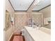 Cozy bathroom featuring a decorative shower curtain and ample vanity space at 7242 Sw 115Th Pl, Ocala, FL 34476