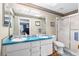 Bathroom with double sinks, vanity, and shower at 7242 Sw 115Th Pl, Ocala, FL 34476