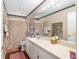 Bathroom featuring a decorative shower curtain, mirror, and ample vanity space at 7242 Sw 115Th Pl, Ocala, FL 34476