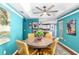 Dining room showcasing its tray ceilings and hardwood floors at 7242 Sw 115Th Pl, Ocala, FL 34476
