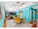 Dining area boasts custom turquoise walls, hardwood floors, and ample natural light at 7242 Sw 115Th Pl, Ocala, FL 34476