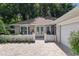 Charming single-story home featuring a brick driveway, manicured lawn, and attached two-car garage at 7242 Sw 115Th Pl, Ocala, FL 34476