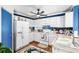 Bright kitchen featuring white cabinetry, blue tile backsplash, and stainless steel refrigerator at 7242 Sw 115Th Pl, Ocala, FL 34476