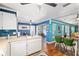 Open floorplan with breakfast nook, dining area and kitchen featuring white appliances, and colorful backsplash at 7242 Sw 115Th Pl, Ocala, FL 34476