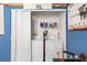 Convenient laundry area with washer, dryer and shelving for storage at 7242 Sw 115Th Pl, Ocala, FL 34476
