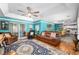 Spacious living room with access to the backyard, flowing into the kitchen area at 7242 Sw 115Th Pl, Ocala, FL 34476