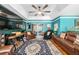 Inviting living room with large TV and comfortable seating arrangement at 7242 Sw 115Th Pl, Ocala, FL 34476