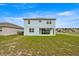 The home features a spacious backyard and covered patio area at 7695 Sw 64Th Street Rd, Ocala, FL 34474