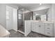 Modern bathroom with glass-enclosed shower and double vanity with ample counter space at 7695 Sw 64Th Street Rd, Ocala, FL 34474